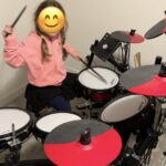 student taking drum lesson